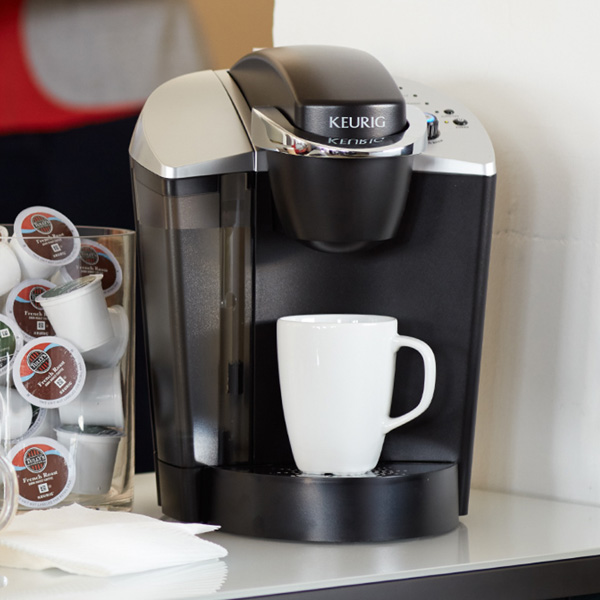 keurig coffee machine brewing coffee into a large white mug