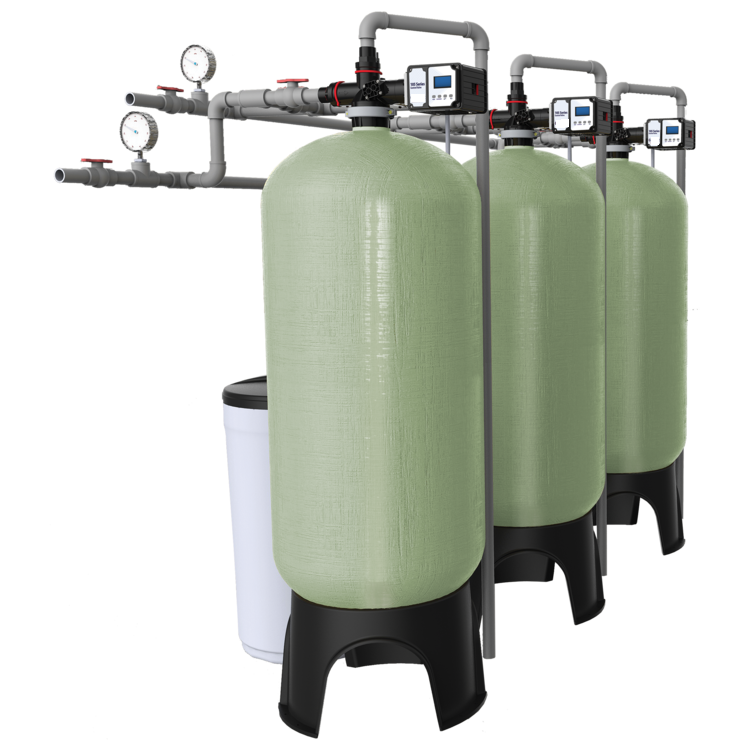 three identical green water softening tanks